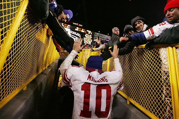 Eli Manning leaves the field after the NY Giants defeated the Green Bay Packers, getting his team to Super Bowl XLVI.  Green Bay, Wisconsin