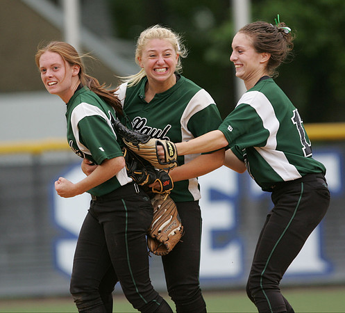 The DePaul softball team celebrates the third out during a playoff game.  South Orange, NJ