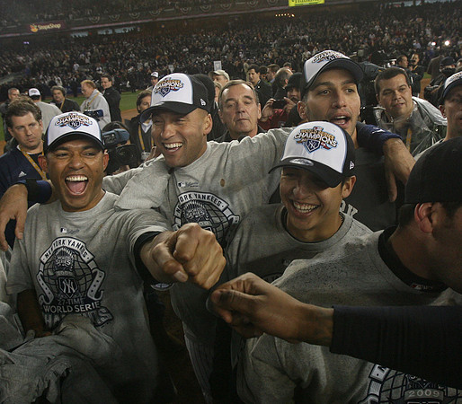 The NY Yankees including Mariano Rivera, Derek Jeter, Ramiro Pena and Andy Pettitte celebrate winning the World Series.  Bronx, NY