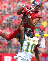 Andre Patton of Rutgers goes up and catches a pass over Sandy Chapman of Norfolk State to setup Rutgers first touchdown.