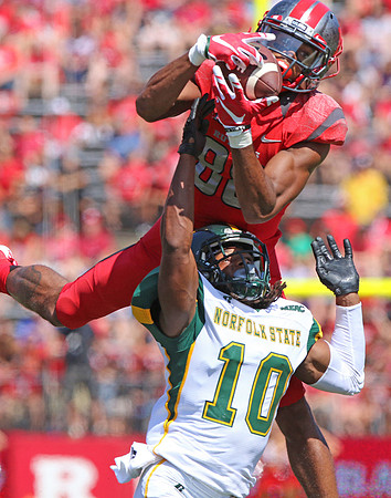 Andre Patton of Rutgers goes up and catches a pass over Sandy Chapman of Norfolk State to setup Rutgers first touchdown.