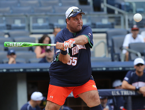 Governor Chris Christie attends a fourth annual "Bombers-Boomer-Broadway Softball Classic" fundraiser at Yankee Stadium. The charity is run by former NFL quarterback Boomer Esiason.