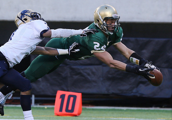 The ball slips through the finger tips of St. Josephs receiver RJ Edwards.   East Rutherford, NJ