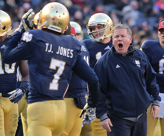 Notre Dame head coach Brian kelly yells at TJ Jones after Jones couldn't make a catch in the end zone in the second half of the Pinstripe Bowl.  Bronx, NY