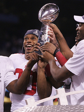 Victor Cruz with the Lombardi Trophy after the Giants defeated the New England Patriots in Super Bowl LXVI. Indianapolis, Indiana