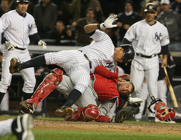 Yankees Alex Rodriguez is tagged out at home by Angel catcher Jeff Mathis in the fifth inning during Game 1 of the American League Championship Series.  Bronx, NY