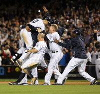Derek Jeter and his team mates celebrate his game winning hit in the ninth inning during his last game at Yankee Stadium.    Bronx, NY
