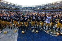 Notre Dame players as they sing their Alma Mater after winning the Pinstripe Bowl at Yankee Stadium.    Bronx, NY